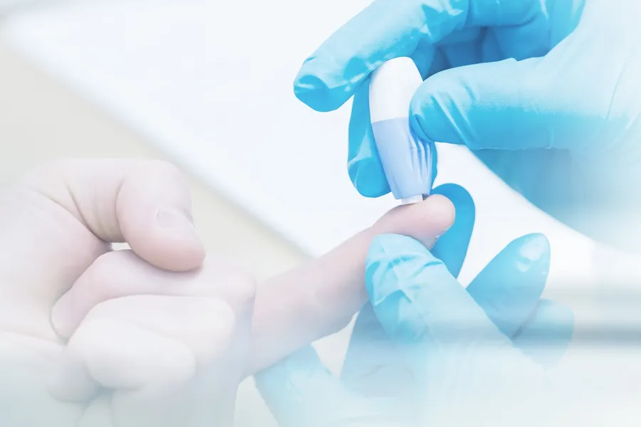 Gloved hand performing a blood sugar check with a lancet. Morgan Burns, APRN offers expert Functional Medicine for Type 2 Diabetes care in Central Florida.