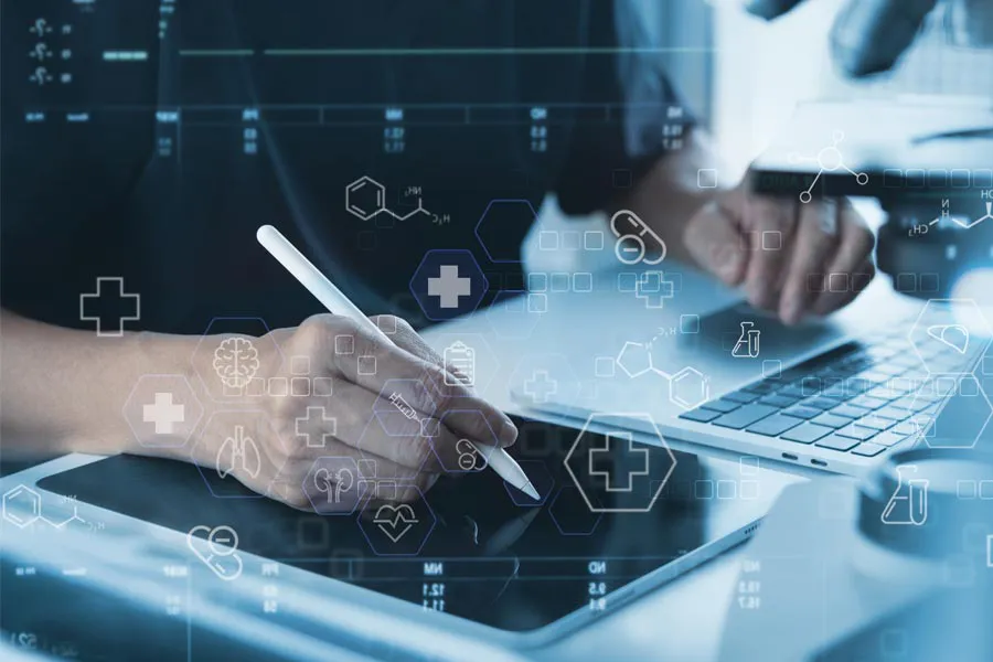 Close-up of a medical professional using a laptop and tablet, with illustrated medical symbols overlayed on the image, symbolizing health conditions treated by Christine Collins, MD in Westside/Beverly Hills.