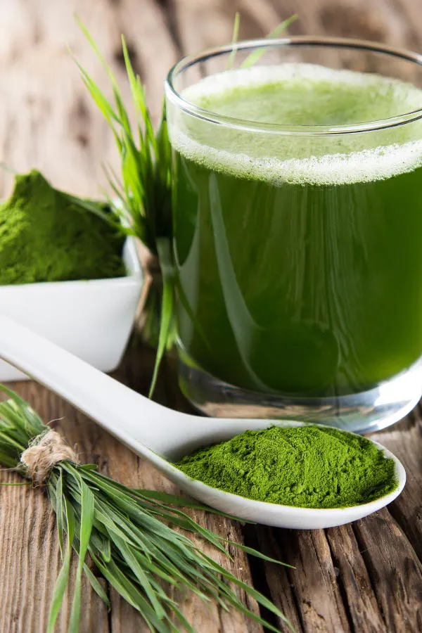 Healthy green juice and herbs. Get Tri-Immune Boost Injection treatments from Christine Collins, MD in Westside/Beverly Hills.