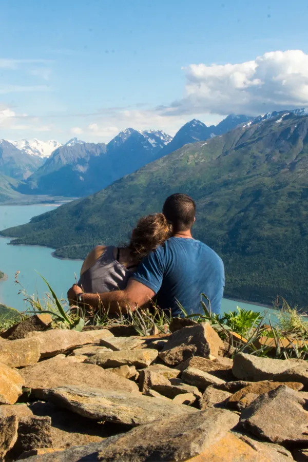 A couple embrace on a mountaintop. Get theta chamber treatment from Christine Collins, MD in Westside/Beverly Hills.