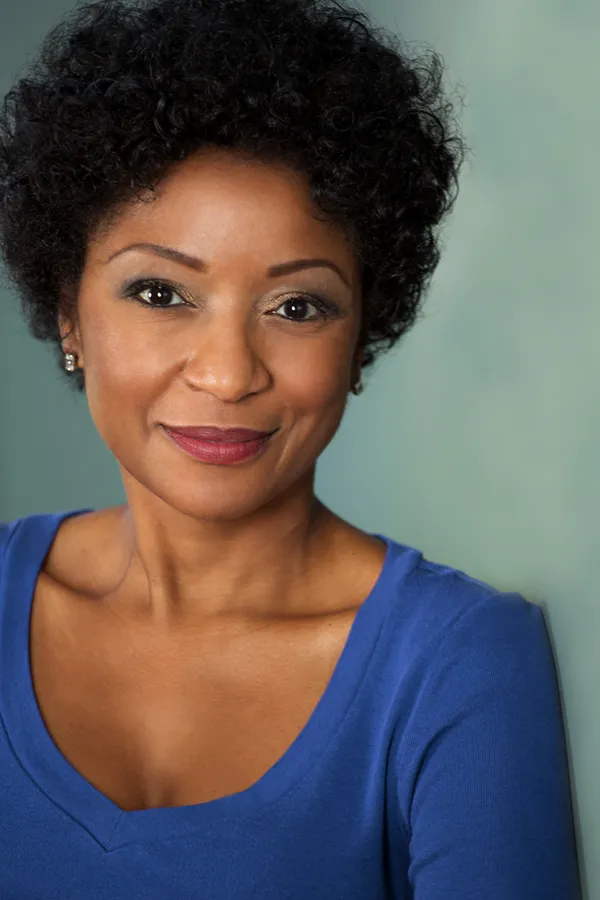 A middle-aged Black woman. Get treatment for vaginal atrophy from Christine Collins, MD in Westside/Beverly Hills.
