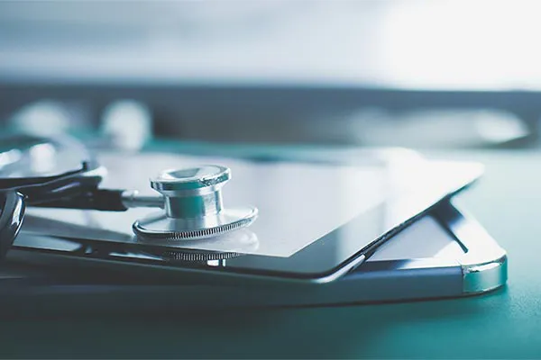 Close up of a stethoscope lying on a tablet, representing advanced functional medicine testing offered by Frank Lanzisera, D.C. in Tampa Bay Metro.