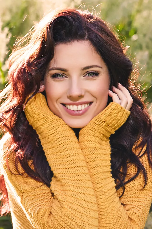 A woman with long brown hair and beautiful skin. Get IV Therapy for skin health from Frank Lanzisera, D.C. in Tampa Bay Metro.