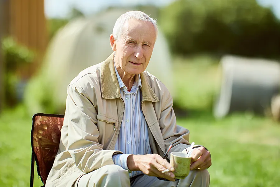A very thin older man sits outside. Get treatment for muscle atrophy from Frank Lanzisera, D.C. in Tampa Bay Metro.