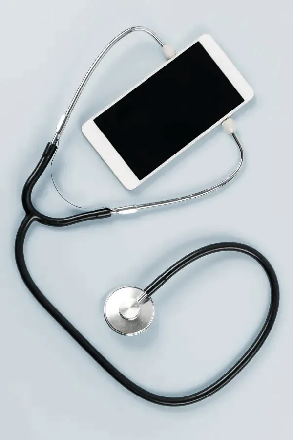 A smartphone with a stethoscope attached to it, symbolizing Telemedicine treatment from Frank Lanzisera, D.C. in Tampa Bay Metro.