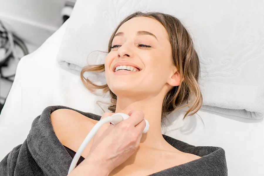 A woman gets her thyroid examined with an ultrasound device. Get thyroid testing from Frank Lanzisera, D.C. in Tampa Bay Metro.